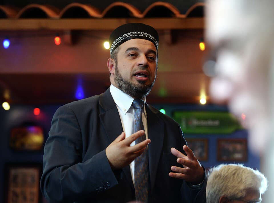 Nidal Alsayyed gesturing during a presentation